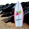 Walled Flower little surfboard model upright in sand