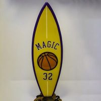 Team Spirit little surfboard model on wooden stand